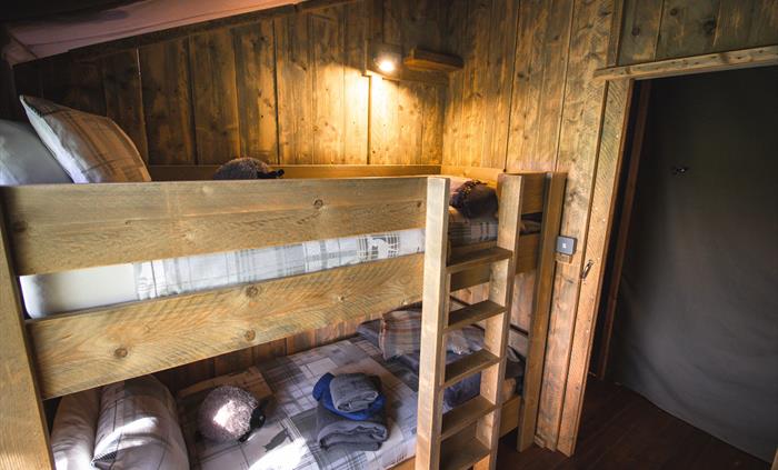 Bunk bedroom with cosy bedding and blankets to keep warm.